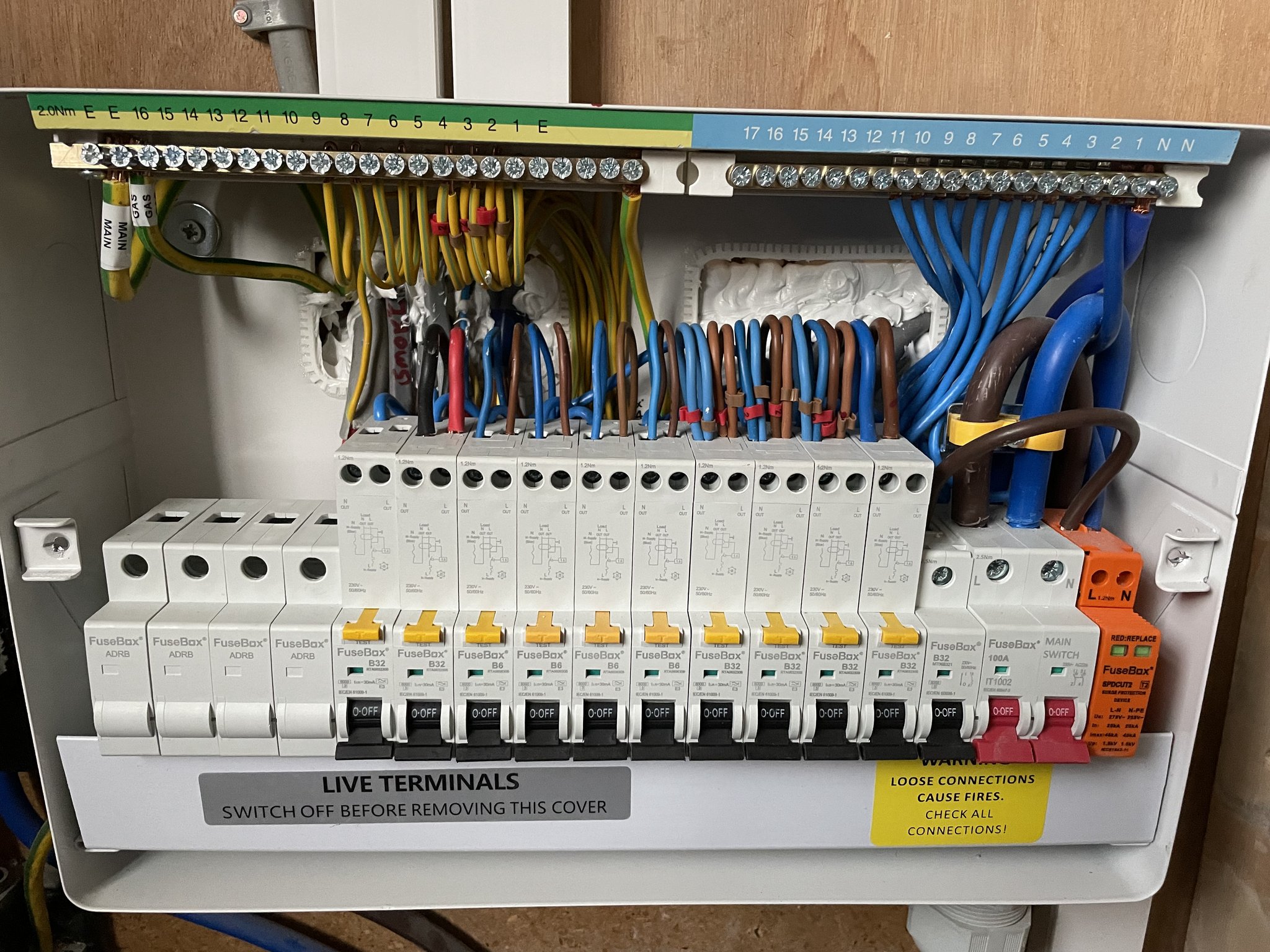 A new consumer unit with a row of RCBOs and labelled circuits