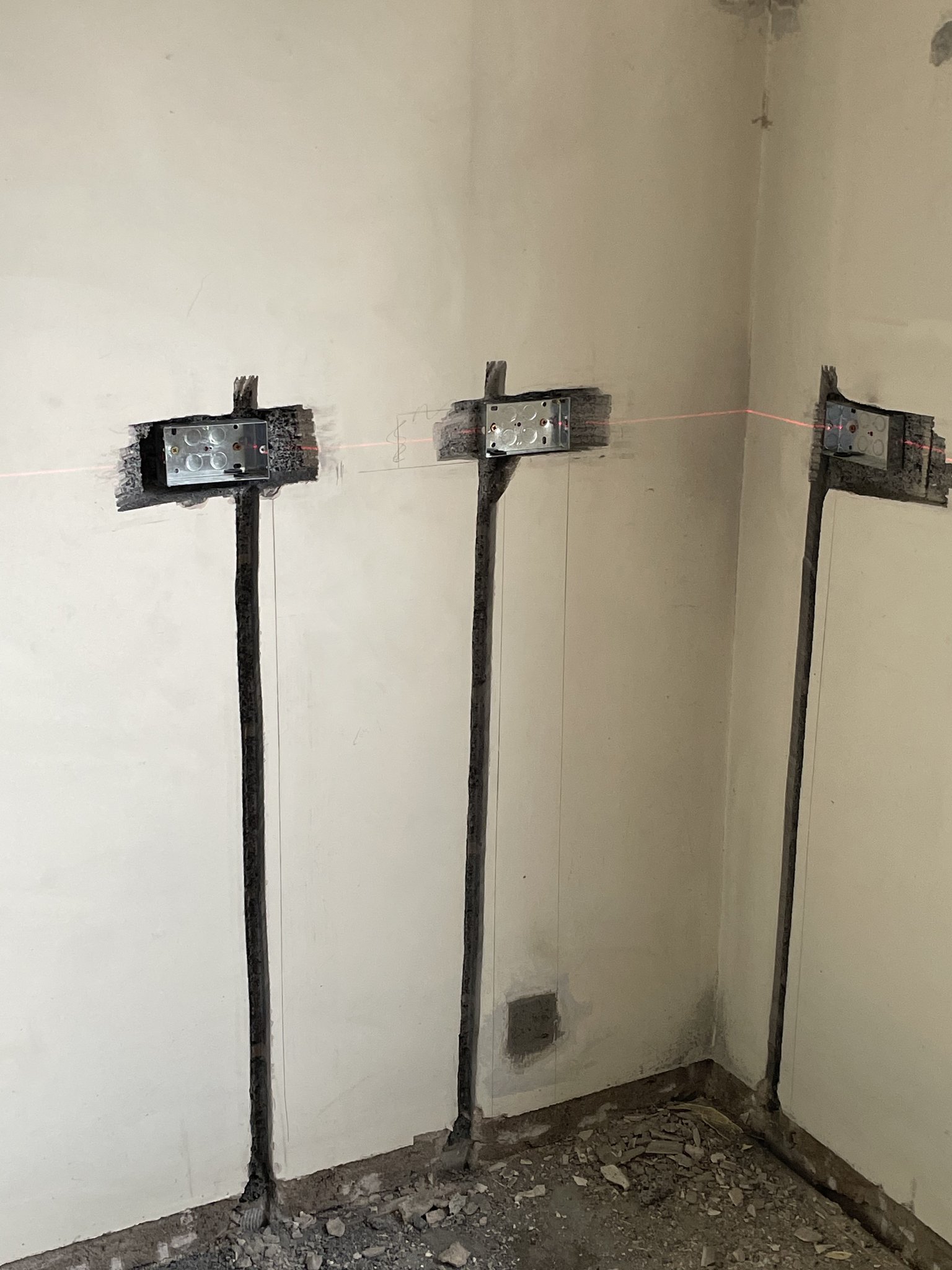 Wall chases and new back boxes cut in during a full rewire